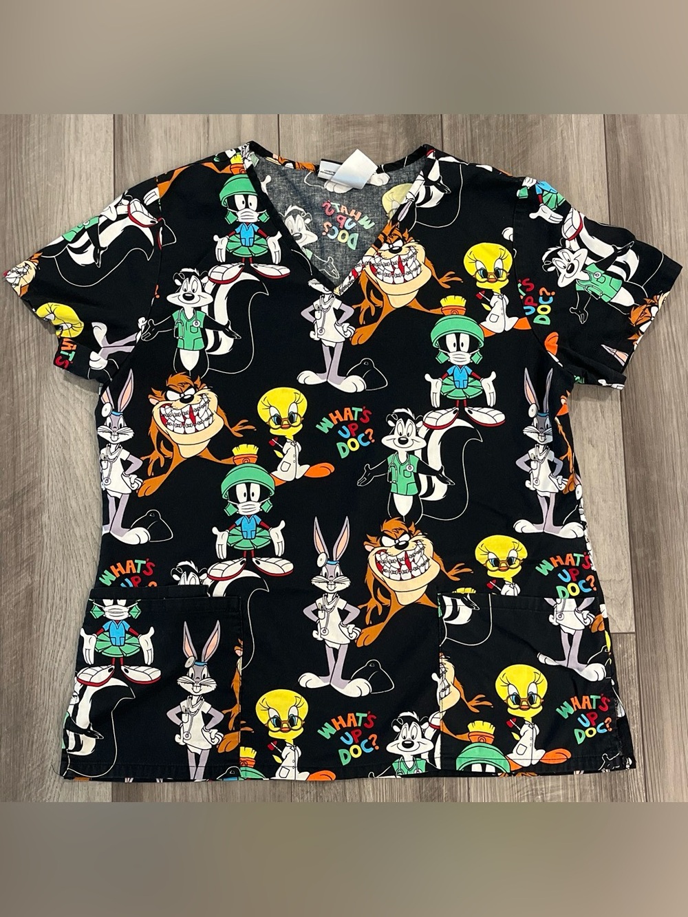 Warner Bros. Black Looney Tunes Print Scrub Top with Multicolor Characters